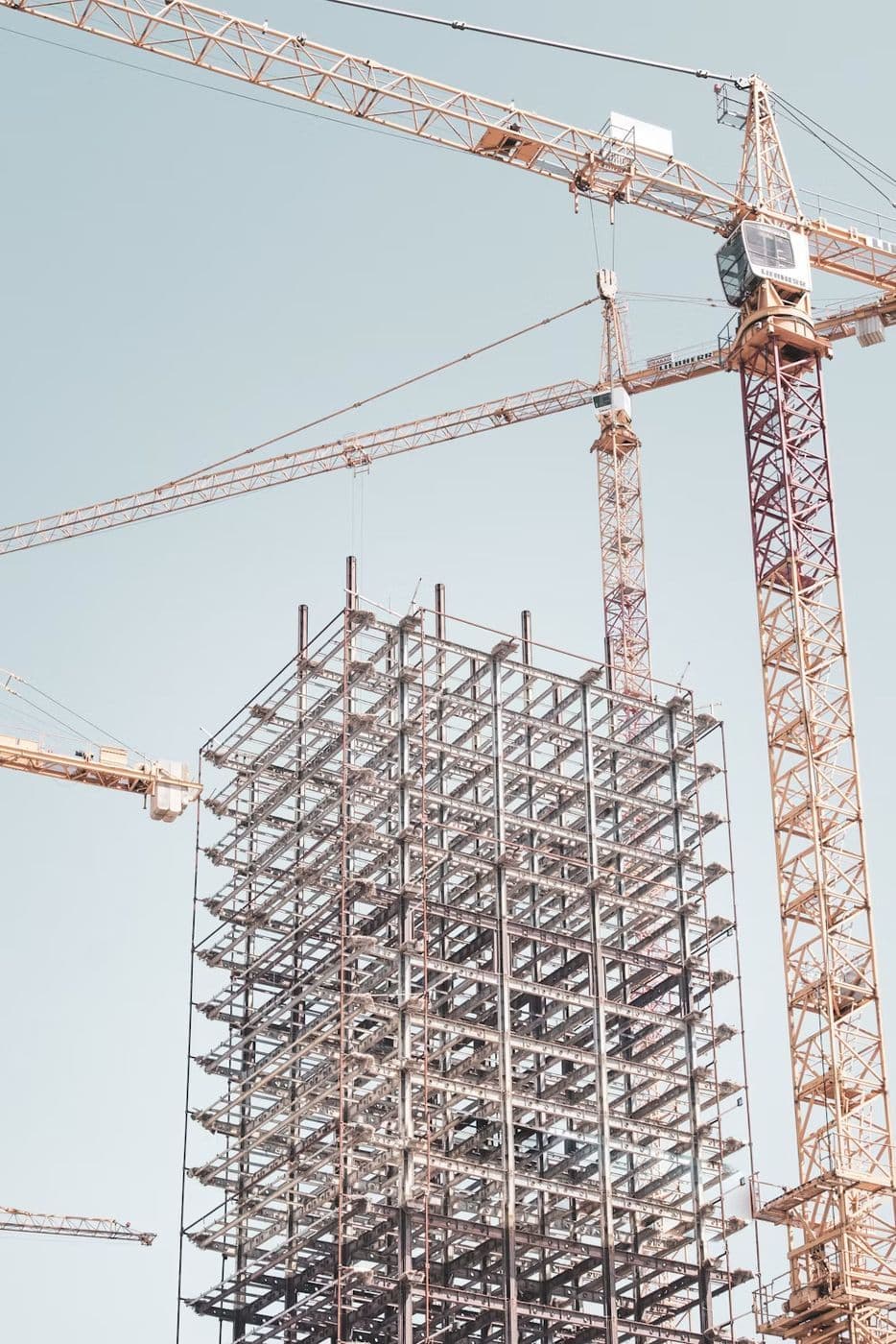 A building frame wrapped in scaffolding